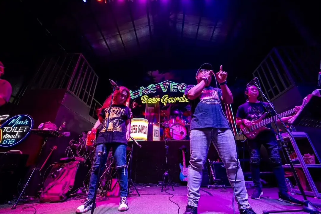 The band on the stage, wide, with the lights